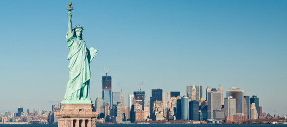 statue of liberty with manhattan in the background