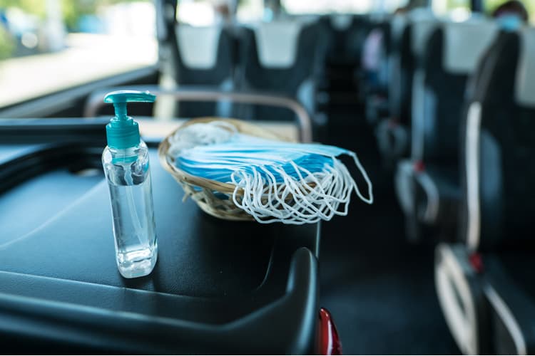 Masks and hand sanitizer on a bus